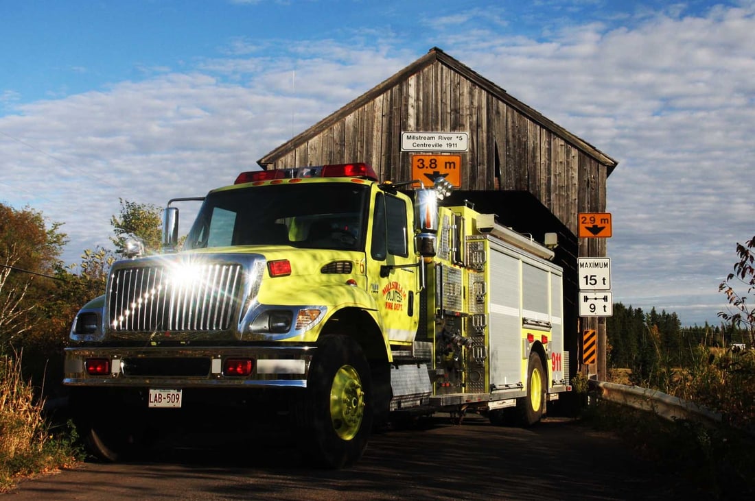 Millstream Fire Departments Fire Apparatus in Front of New Brunswick Covered Bridge